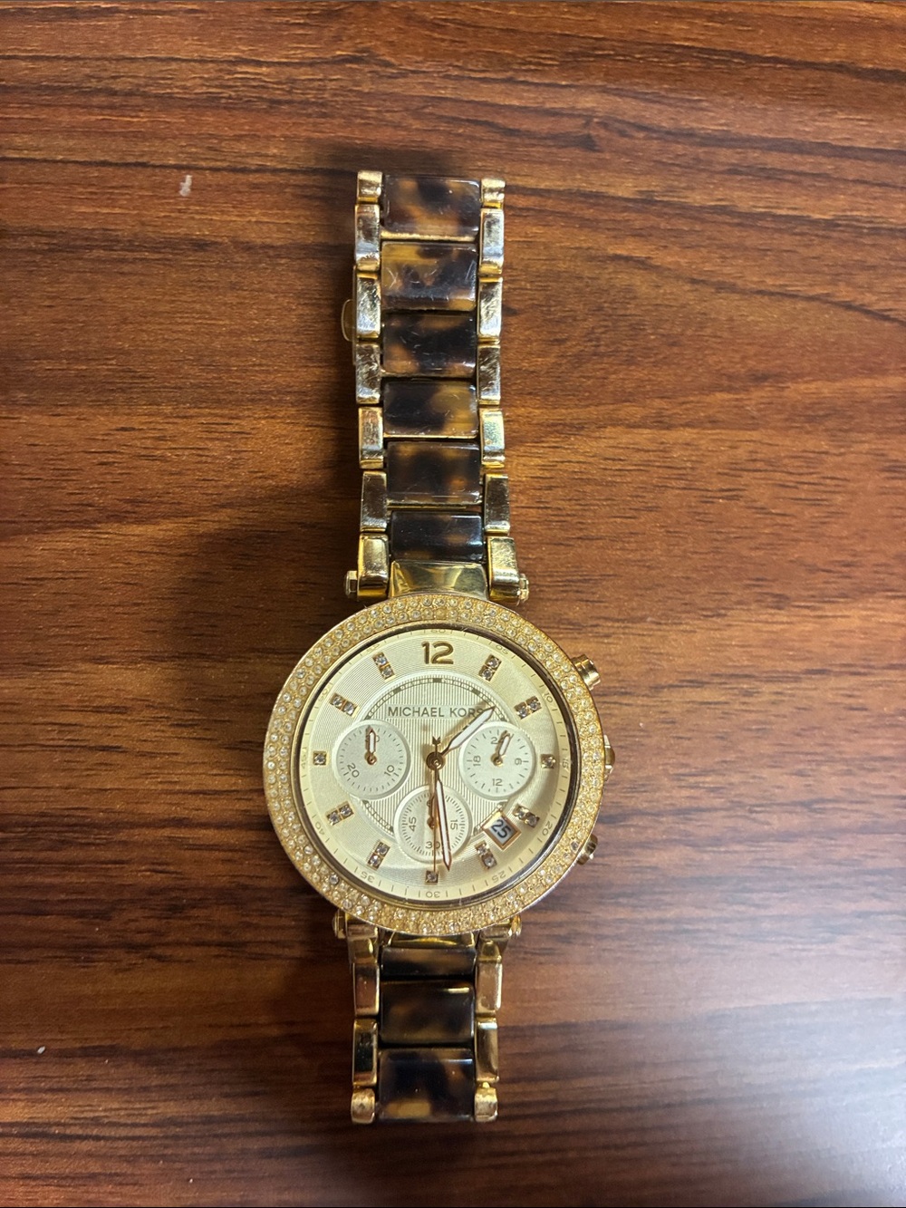 Michael Kors Parker Chronograph in gold-tone, tortoise; and crystal bezel.